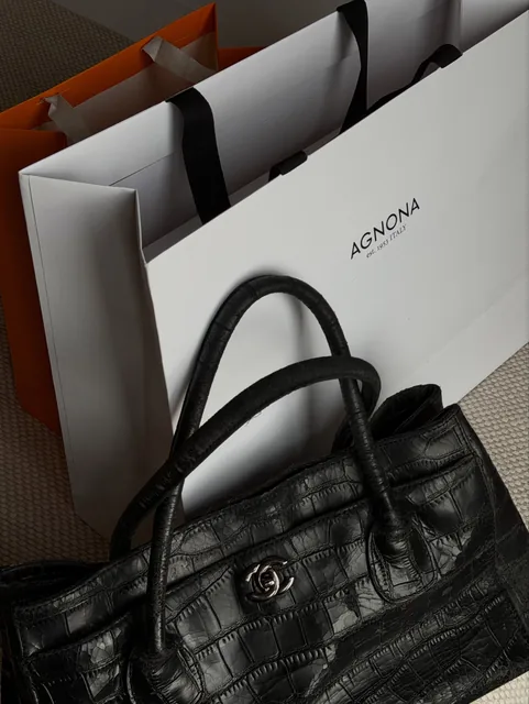 An Agnona shopping bag and a black croc leather bag